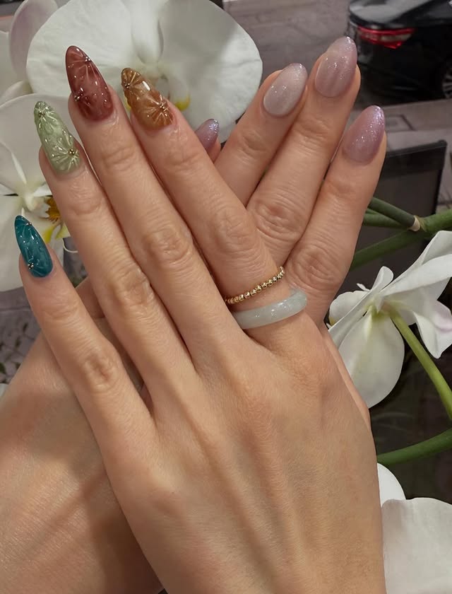 Hand painted floral 3D nail art on almond nails